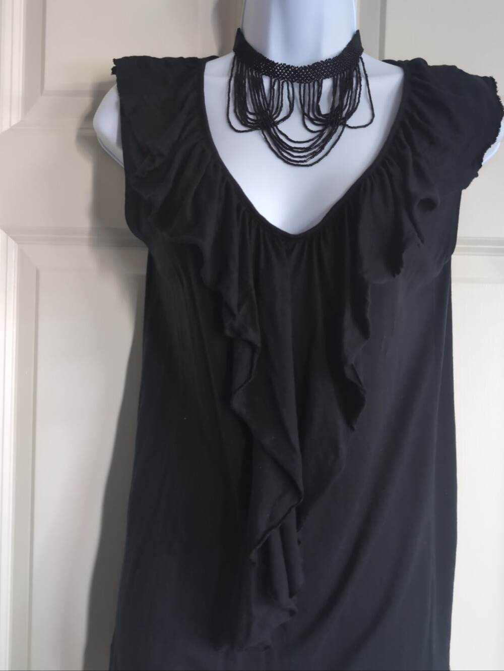 Black ruffle blouse with ruffled neckline and sleeves